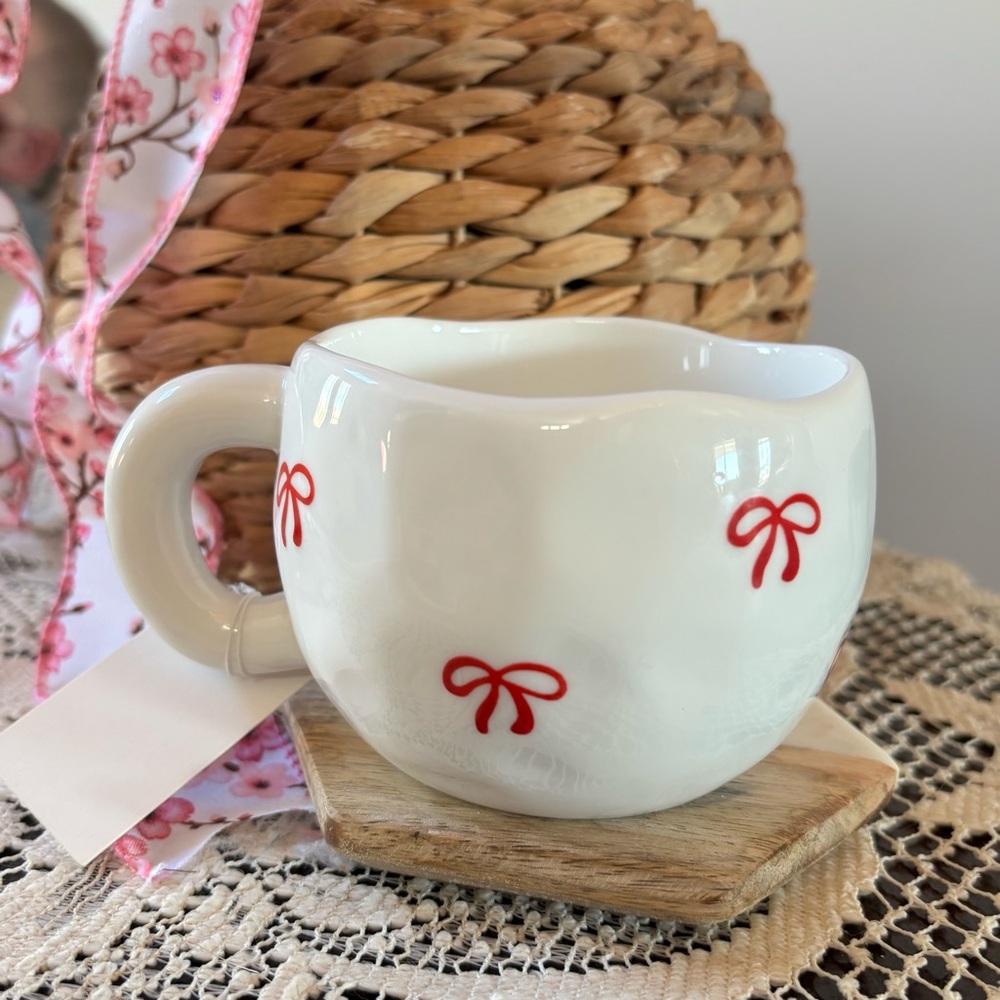 Charming White Ceramic Mug with Red Bow Accents